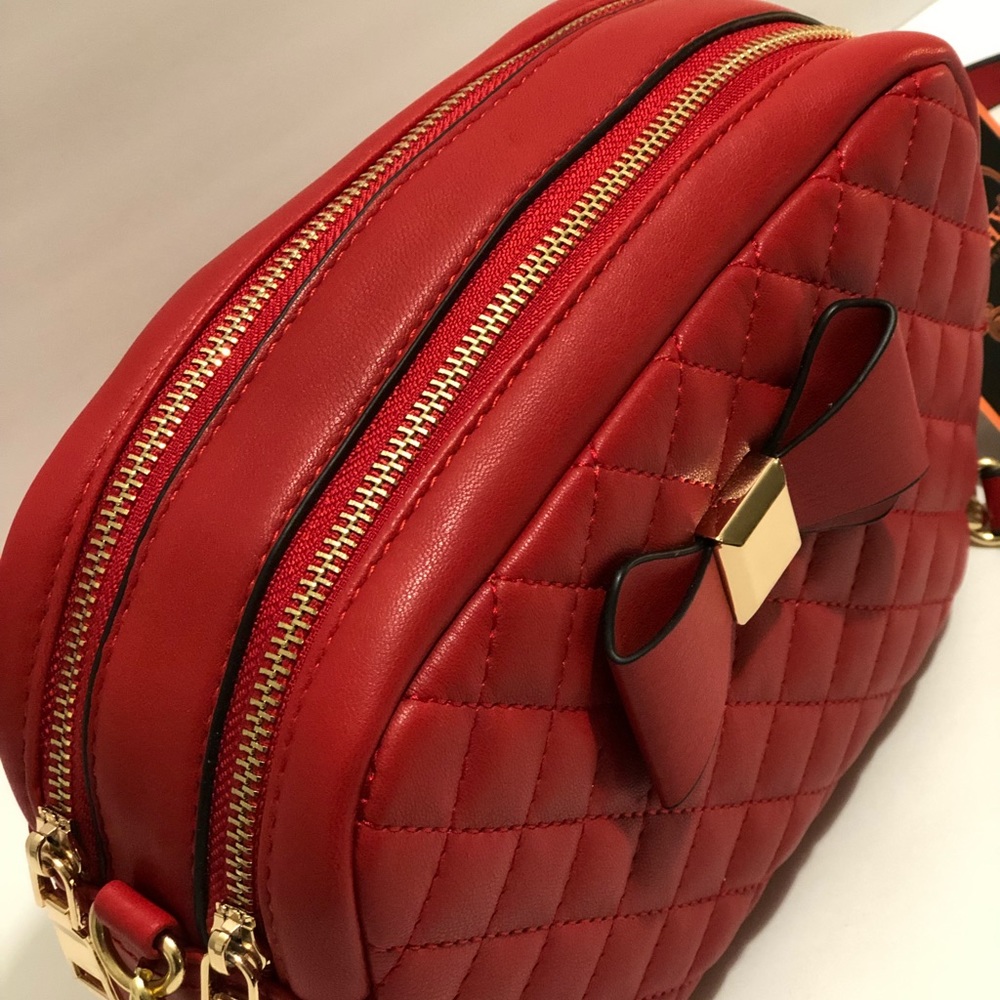 Woman’s small red shoulder purse